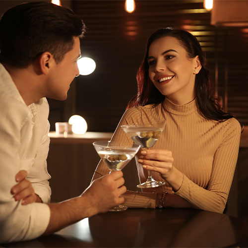 Two People Enjoying Drinks Together