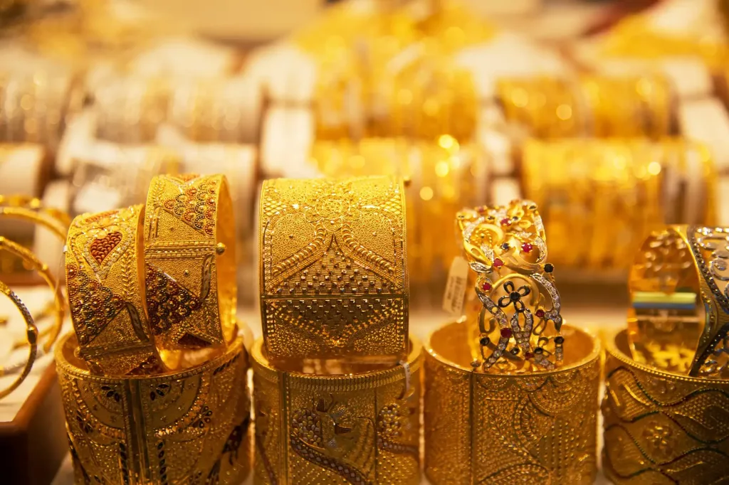 Gold bracelets in a store window in Deira Gold souq in Dubai