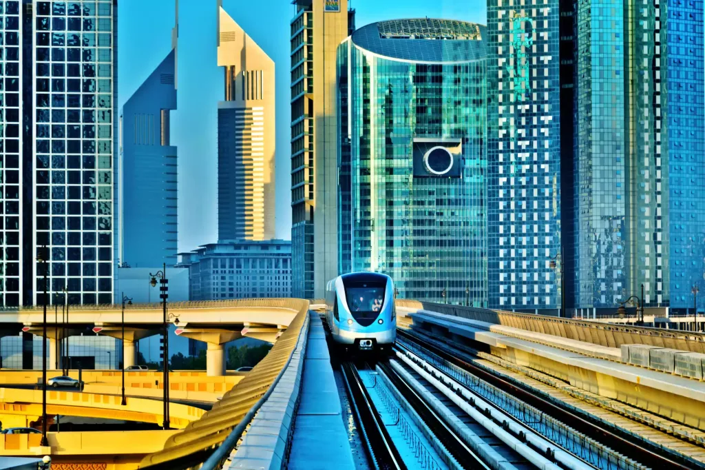Dubai metro with the Dubai skyline in the background.